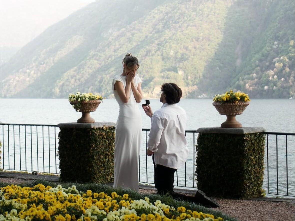 Romantic marriage proposal overlooking a scenic landscape